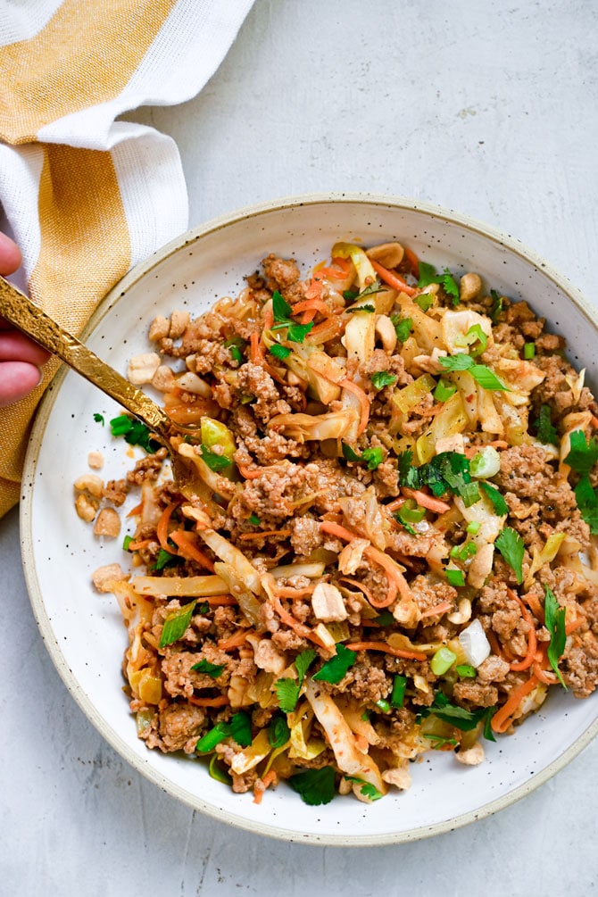 close up peanut pork stir fry flay lay in bowl