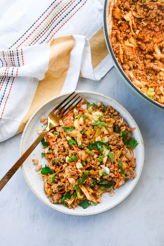 spicy pork stir fry plated with fork