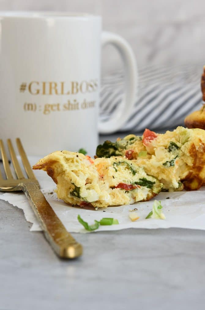Baked Cottage Cheese Egg Muffins cut open with coffee mug