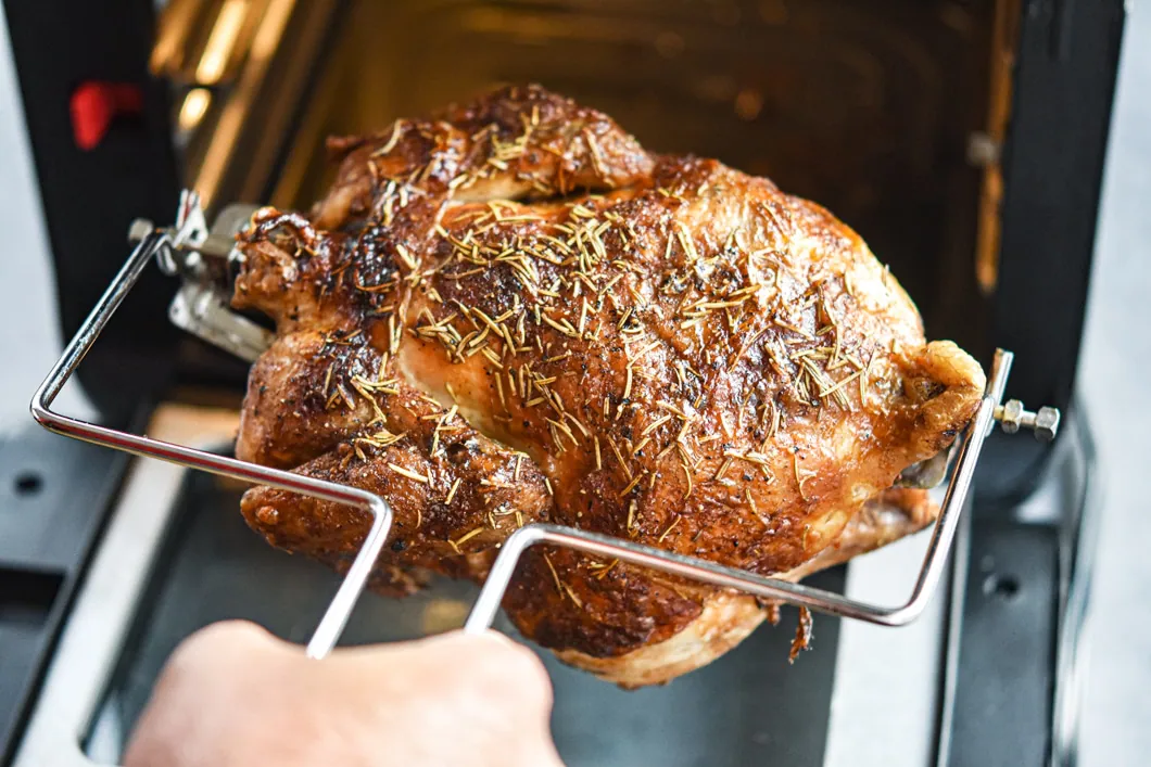 https://mealplanaddict.com/wp-content/uploads/2019/09/Vortex-Rotisserie-Chicken-pulled-out-of-Instant-Vortex.jpg