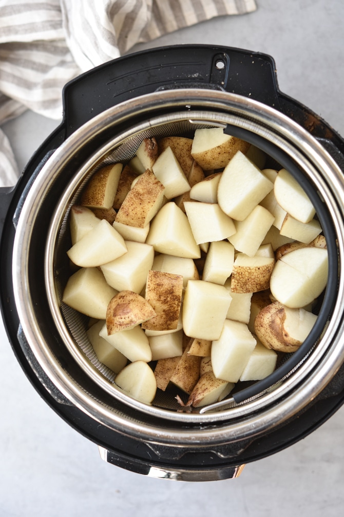 Diced potatoes in Instant pot basket top down