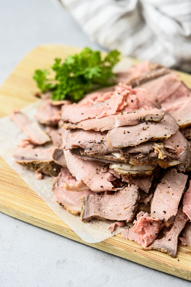 Roast Beef sliced thin on cutting board from above