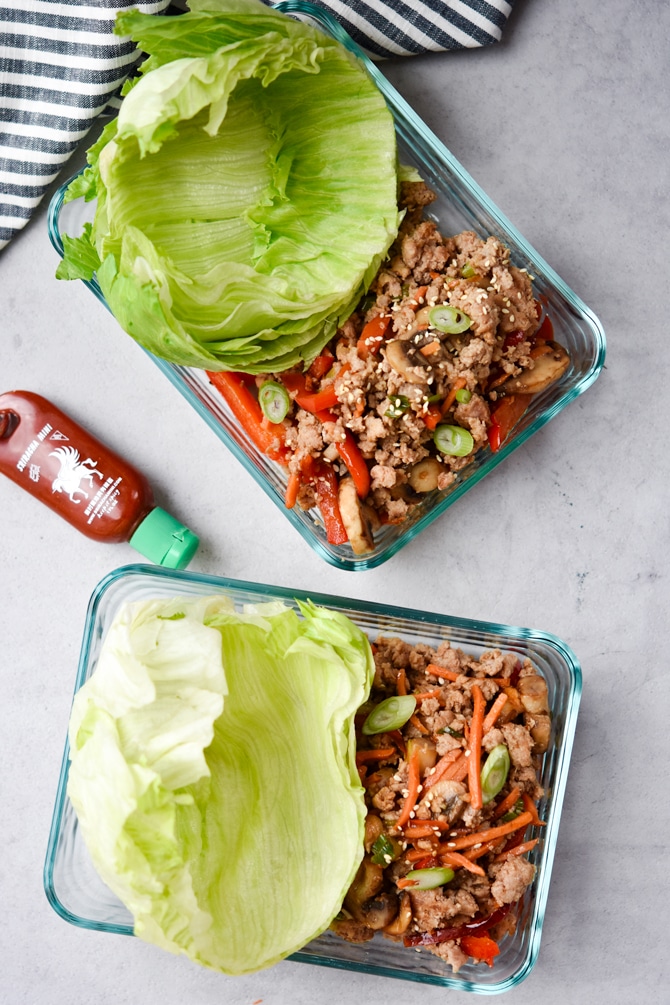 Meal prep pork lettuce wraps in 2 containers flatlay