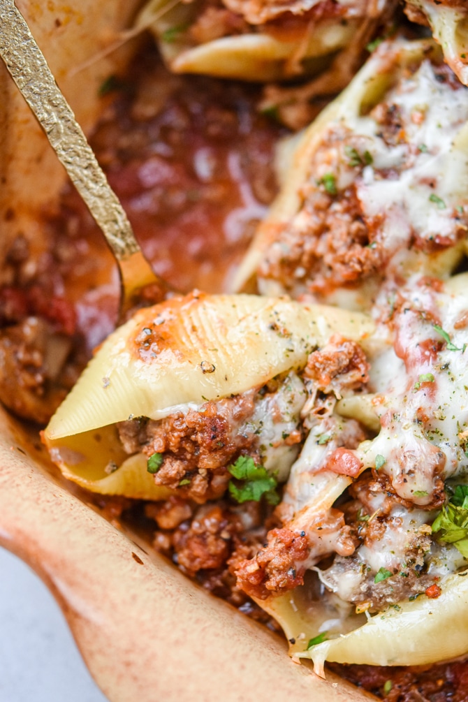 stuffed beef shells on a spoon