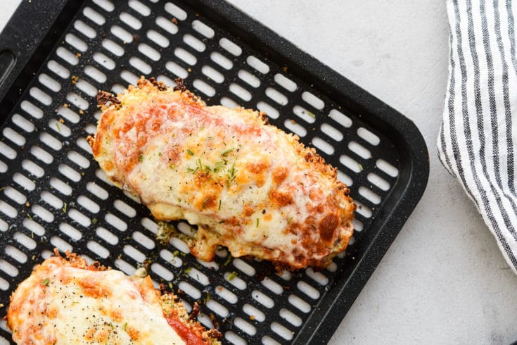 Chicken parm on air fryer tray landscape image