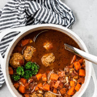 meatball soup in pot with ladle
