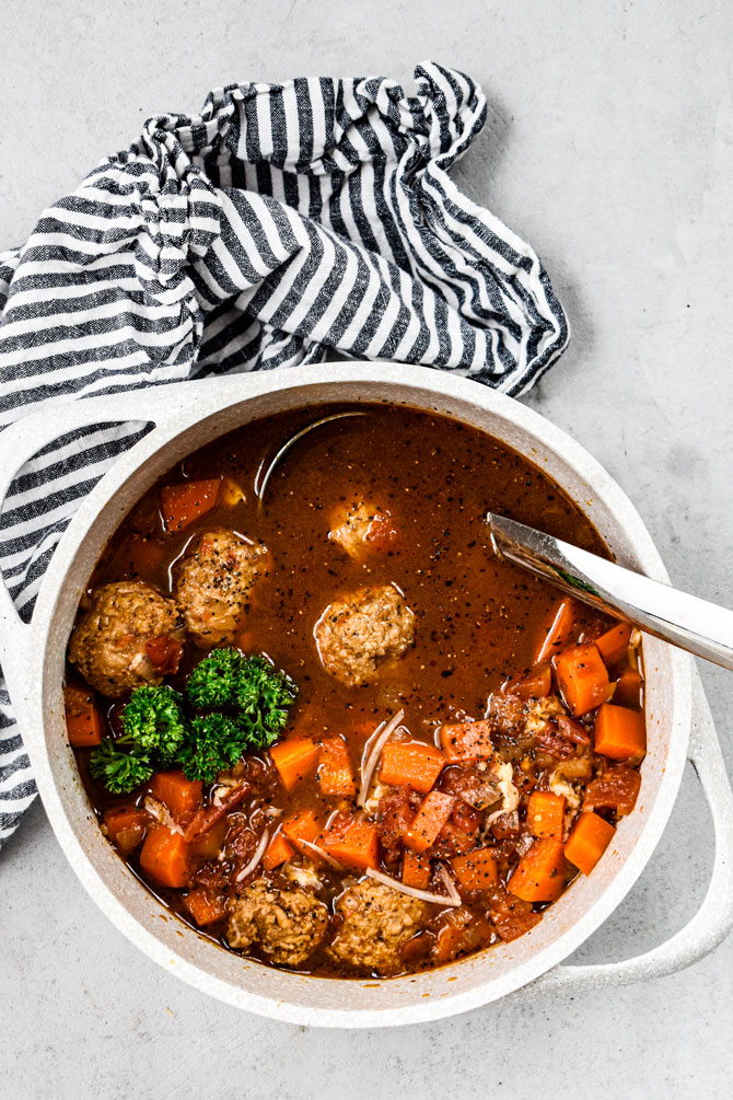 meatball soup in pot with ladle