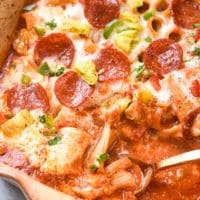 pizza pasta bake with gold spoon