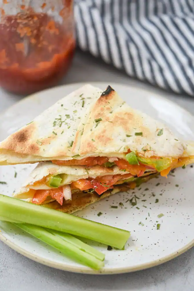 Veggie quesadilla plated with celery_hero shot