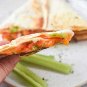 veggie quesadilla cut open to show melted cheese