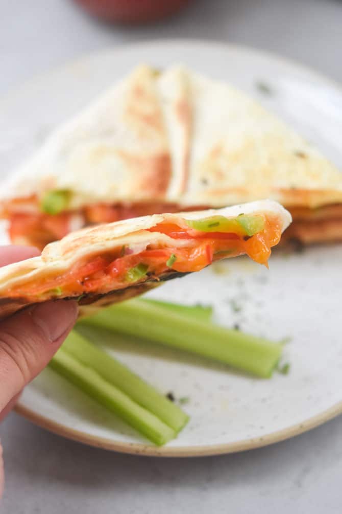 veggie quesadilla cut open to show melted cheese