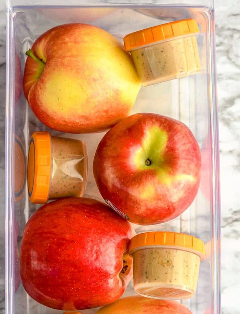 apples and peanut butter in bin