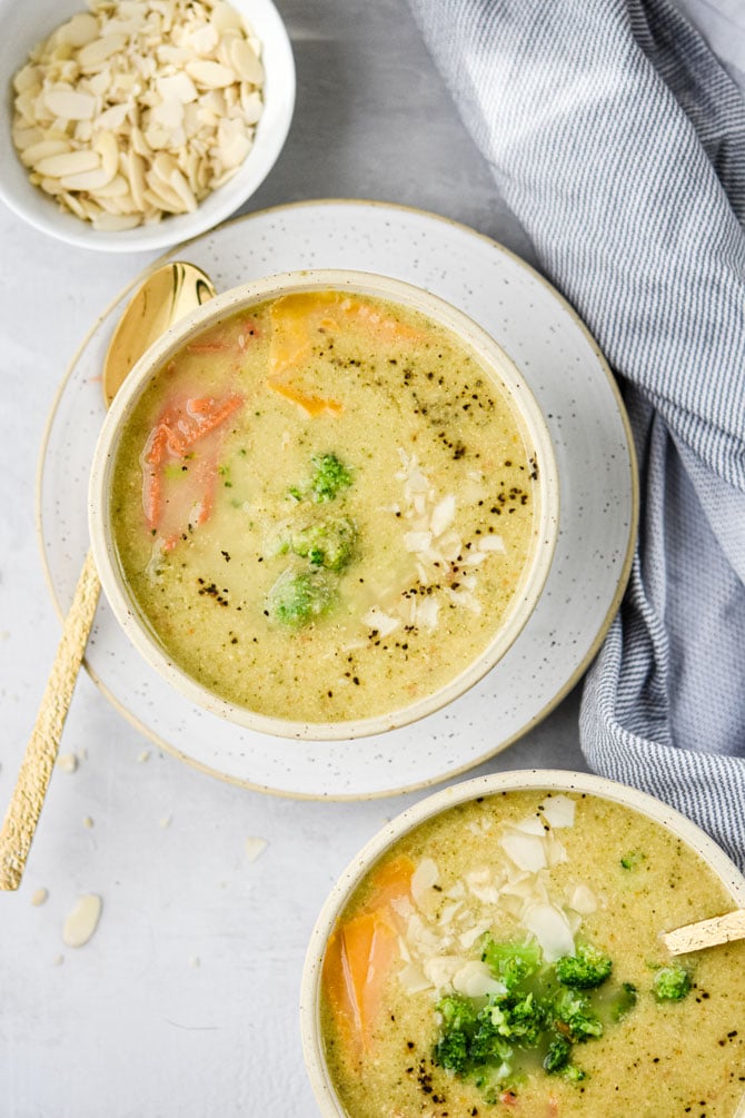 broccoli cheddar soup in 1 bowls with sliced almond bowl