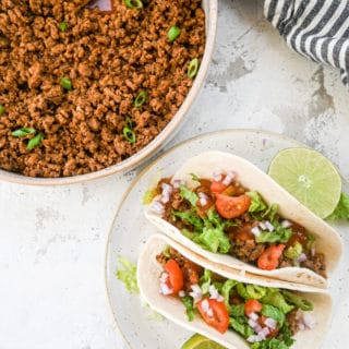 Taco beef tacos with beef in bowl flatlay