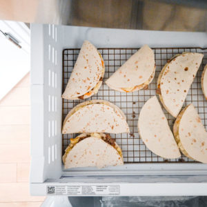 tacos in rack in freezer