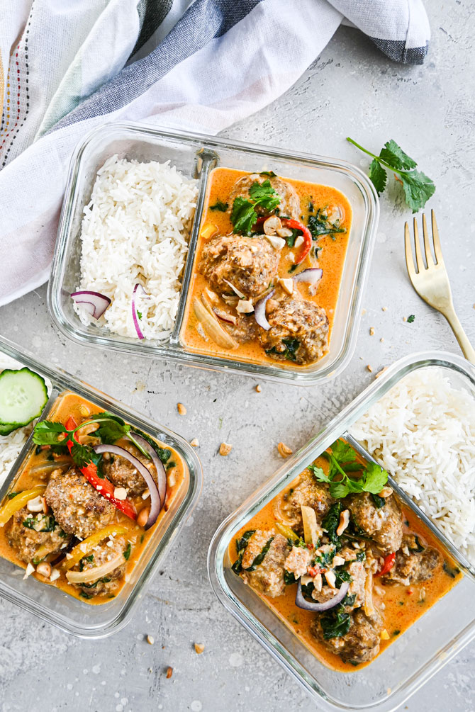Coconut Curry meatballs with rice in glass meal prep containers.